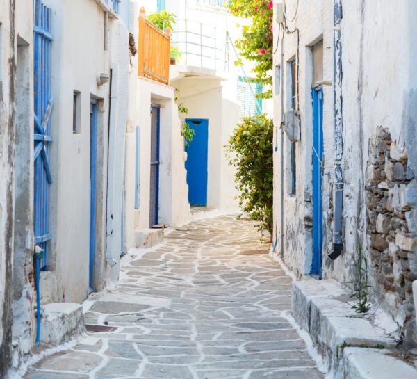 Architecture on the Cyclades. Greek Island buildings with her typical blue doors and white houses in summertime.